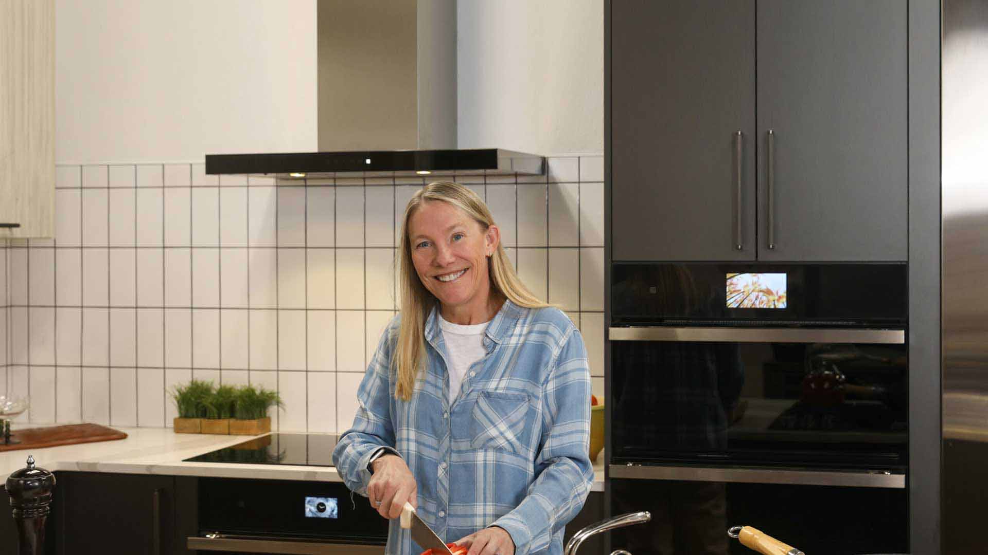 Dr. Kristina cooking in her kitchen