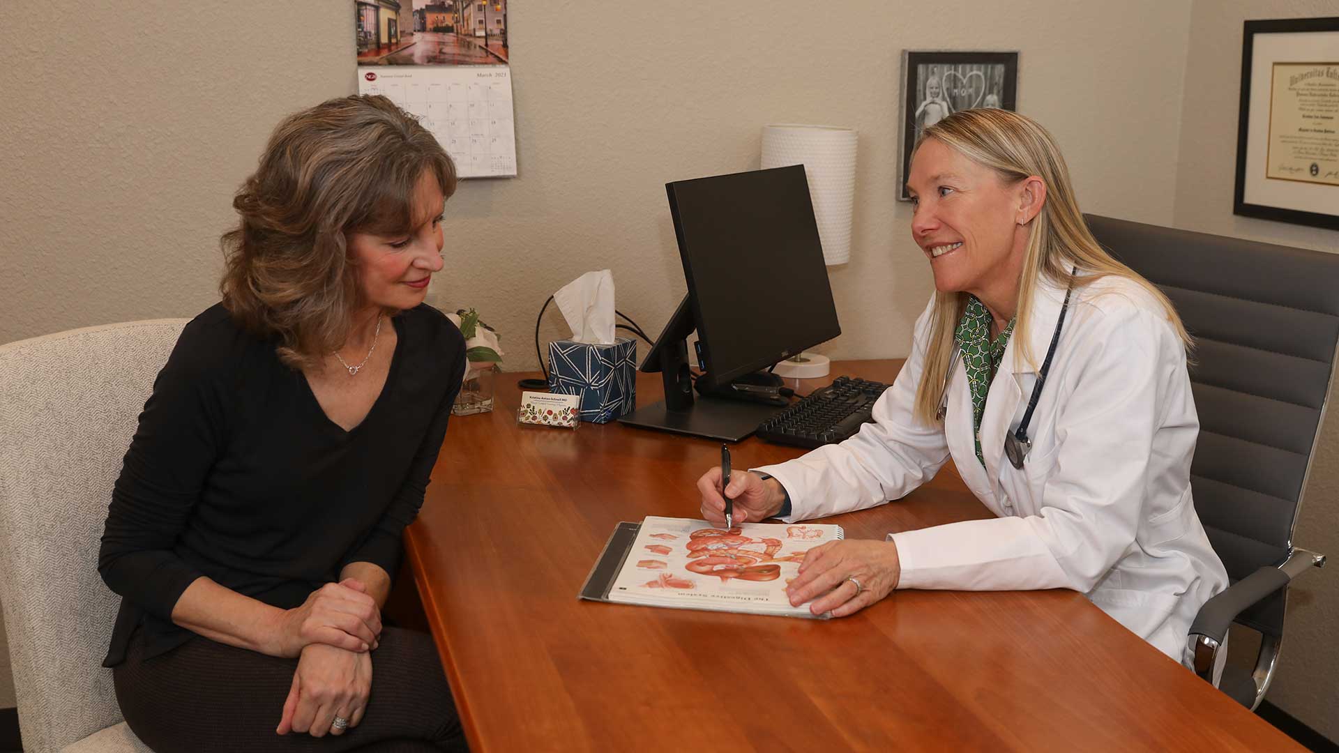 Dr. Kristina consulting a patient